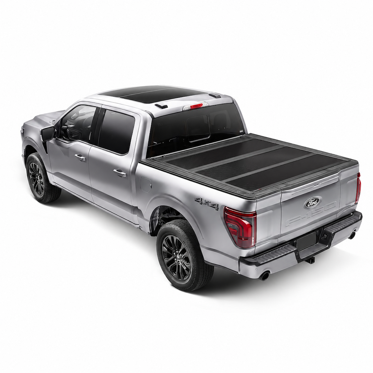 Silver Ford F-150 with a closed hard folding bed cover and covered license plate